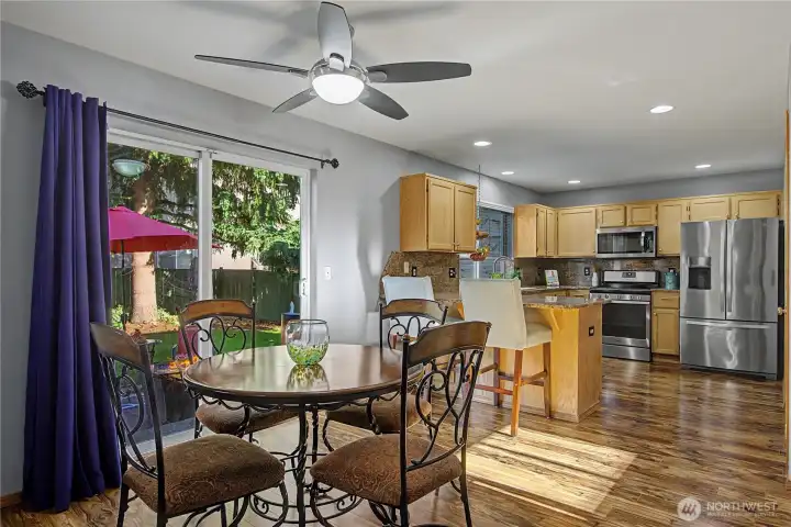 View from living room towards kitchen and sliding glass door to back yard
