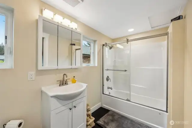 Full Bathroom w/Medicine Cabinet Mirror, 2 Windows, Tile Floor.