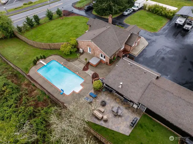 This photo focuses on the Back Patio & Entertainment areas. The Stamped Concrete Patio adds a special touch to this outdoor area. The Pool and Hottub are super private and have just been cleaned for summertime fun!