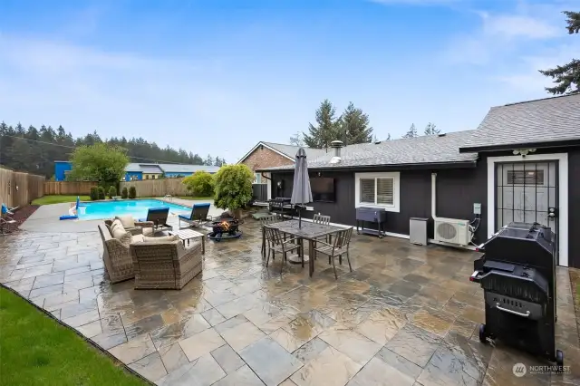 WOW, what a gorgeous patio. Stamped Concrete w/Firepit, Hookups for TV and Door to access both the DADU and the Garage.