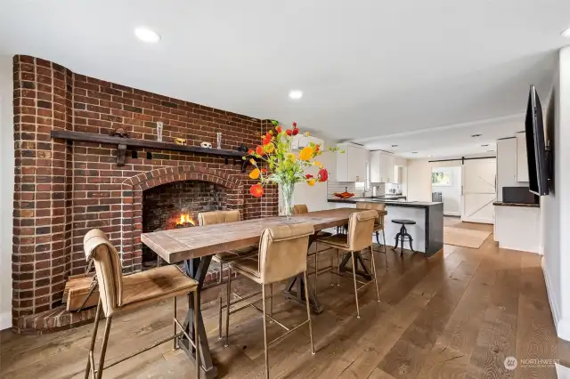 Dining Room w/Custom Brick Fireplace & Hearth & Mantle. This is a wood-burning fireplace, but there is an outlet for an insert if that is desired in the future.