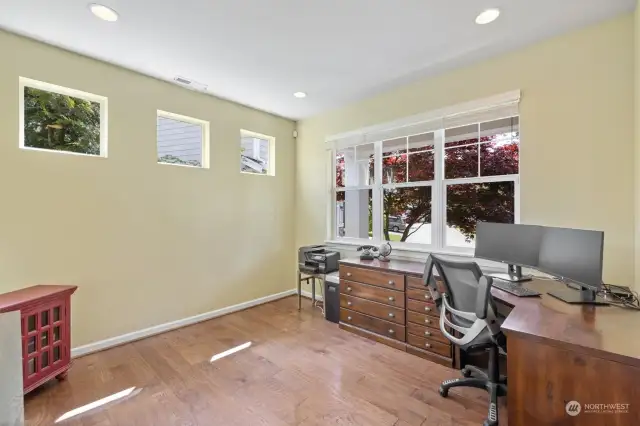 Perfect at-home office space off of entry. Separate from living space and has view of the greenspace across the street.