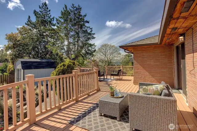 Lots of garden space frame this outdoor area.