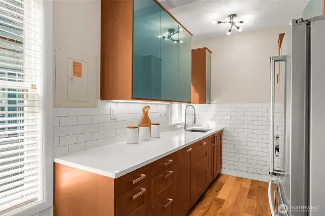 Updated stainless steel appliances, quarts countertops and newer cabinetry.