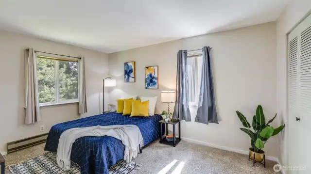 Spacious primary bedroom in this top floor, end unit condo!