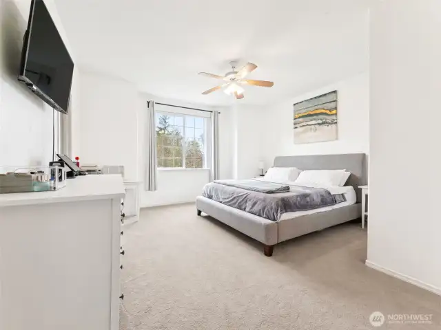 LARGE Primary Bedroom features private bath & walk-in closet.