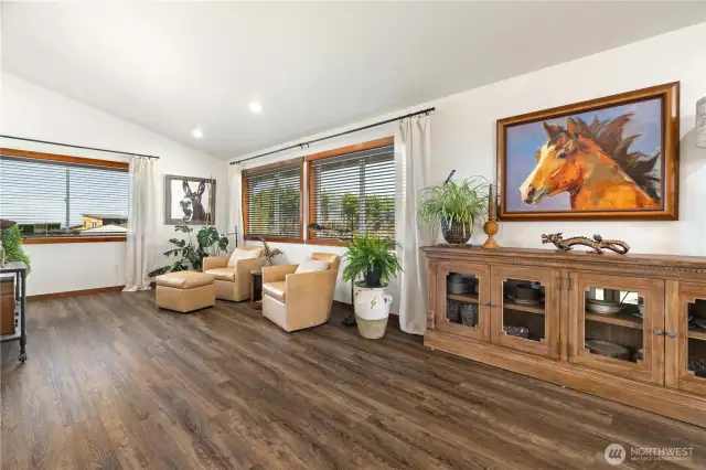 Open area off kitchen and dining room leading to living room
