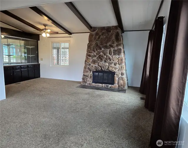 Entry to wood fireplace, and dining hutch built in