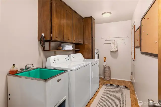 Large utility room with toilet.