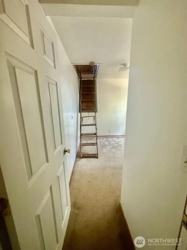 Bedroom #2 with attic ladder