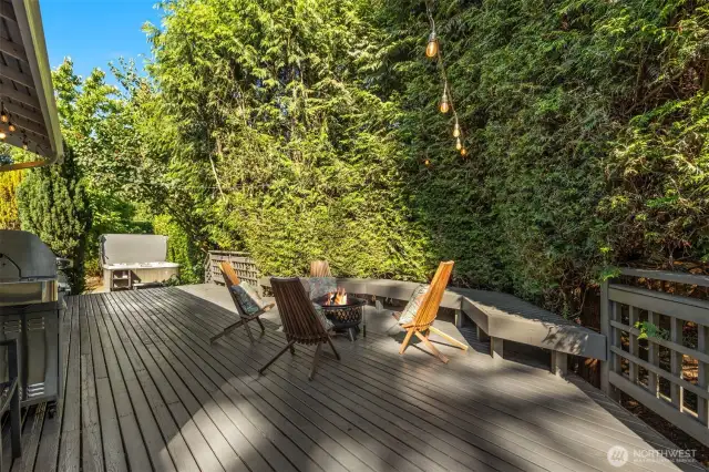 This deck is directly off the kitchen. View of hot tub in the side yard in the distance.