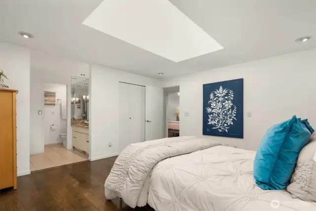 Additional view of primary bedroom featuring double closets and 3/4 bath with steam shower.