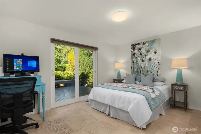 Flex room located on south side of the home with walk out to a private deck and the spacious side yard.