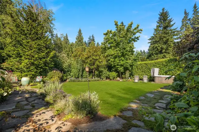 Side yard - North side with pathways and beautiful plantings.
