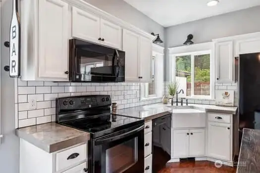 Closer view of kitchen, Wall lights above sink are for decor purposes only, non functional.