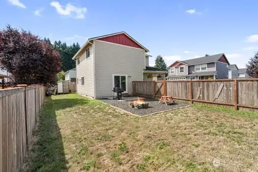 another view of back yard and side of home.