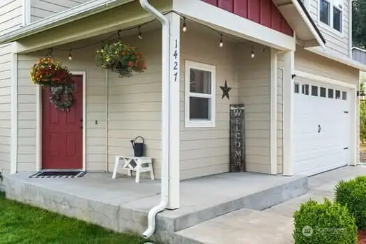 Close up of front door, porch and walkway.