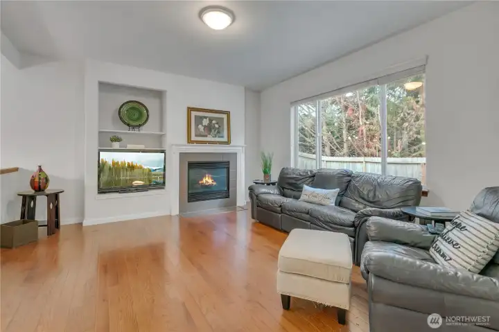 Gas fireplace & large windows make this room comfy & cozy.