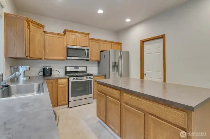 Kitchen with door leading to the walk-in pantry.