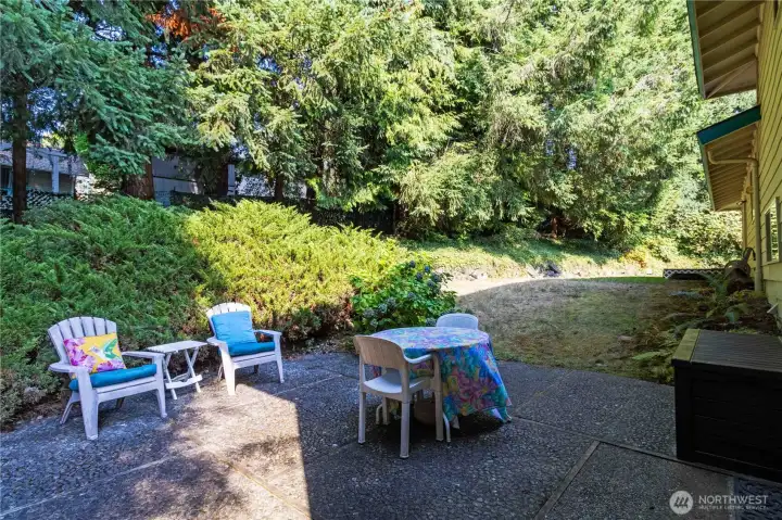 Versatile outdoor living space featuring a patio, deck, and plenty of room to create your own backyard oasis.