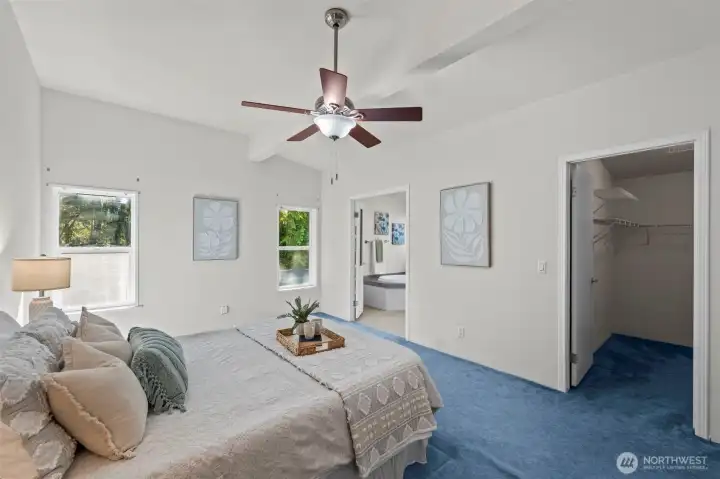Primary bedroom is light-filled and features a huge walk-in closet.