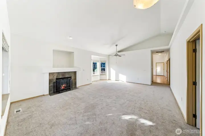 Great room with vaulted ceilings & brand new carpet and paint