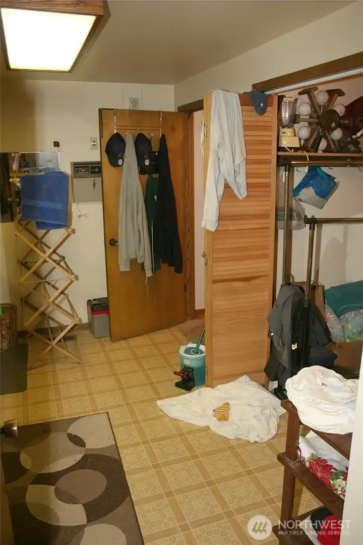 Main floor laundry room with storage