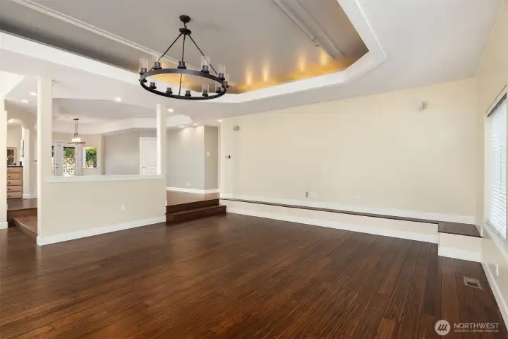 Large living room wall for art, television. Built-in bench seating on east wall of living room.
