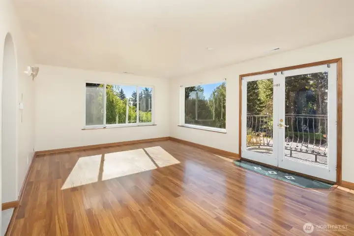 Generously-sized primary bedroom with French doors to Juliet balcony.