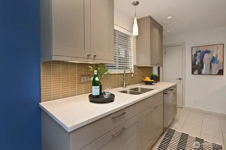 Updated kitchen with lots of cabinets.