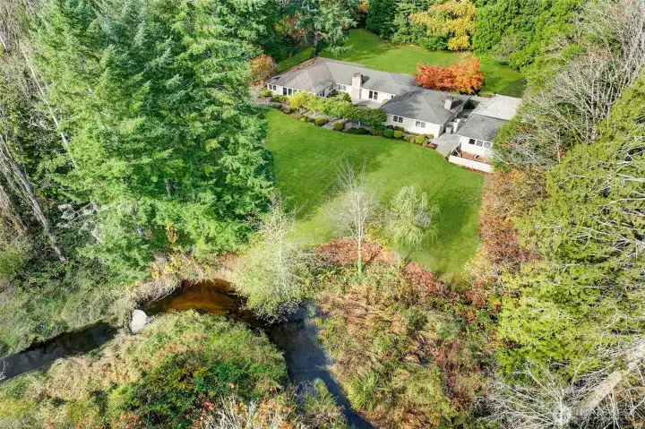 Spacious backyard with Bear Creek at the south tip of property