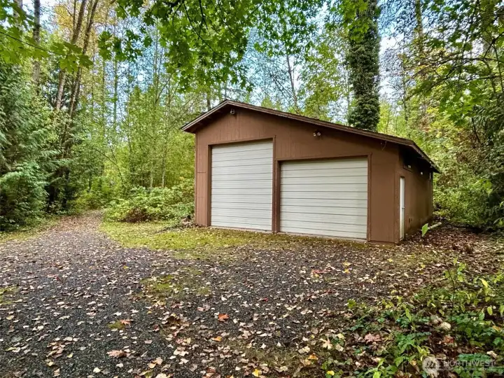 RV Garage with its own separate driveway to the private lane. Driveway is on the left side of RV Garage.