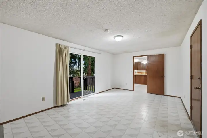 Sliding glass door leads to private backyard.  Door on the right leads to 2-car garage.