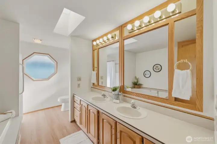 Dual vanity, soaking tub and walk-in shower.