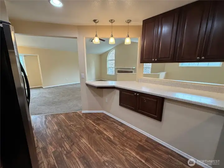Kitchen open to entry and living area