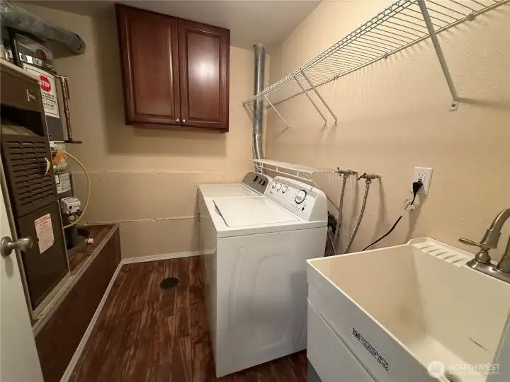 Utility/Laundry room with deep sink. Washer & Dryer remain