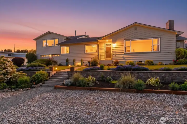 Welcome home to 1119 Longview Ave, Anacortes, a mid-century style home with exceptional landscaping.