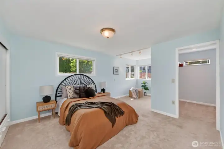 Primary bedroom with walk-in closet toward the bathroom on the right.