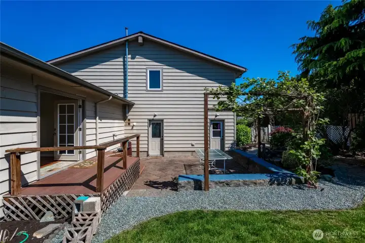 View of back yard toward garage entrance.