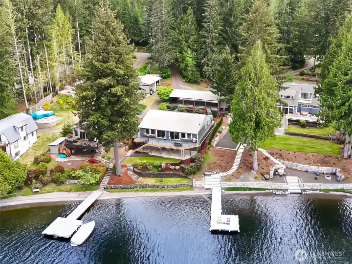 The home, carport and waterfront areas are beautifully maintained and thoughtfully connected, while the four-car carport itself offers not only covered parking but also generous enclosed storage space for all the practical realities of lake life. One quick clarification, the small exterior shed sitting near the property line belongs to the neighboring property, not this one. But what this home absolutely does have is a surprising amount of extra usable space along the road side of the lot, opening the door to all kinds of future possibilities buyers may want to explore over time.