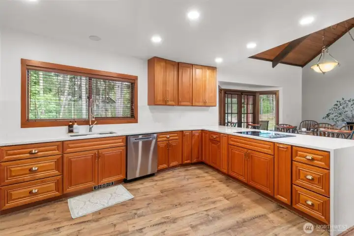New cabinets and quartz counter tops with waterfall edge