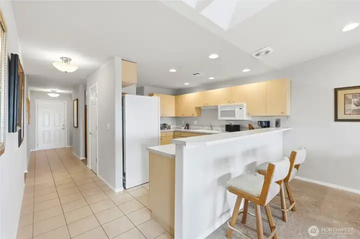 Looking back at entrance, there is a den behind the kitchen.