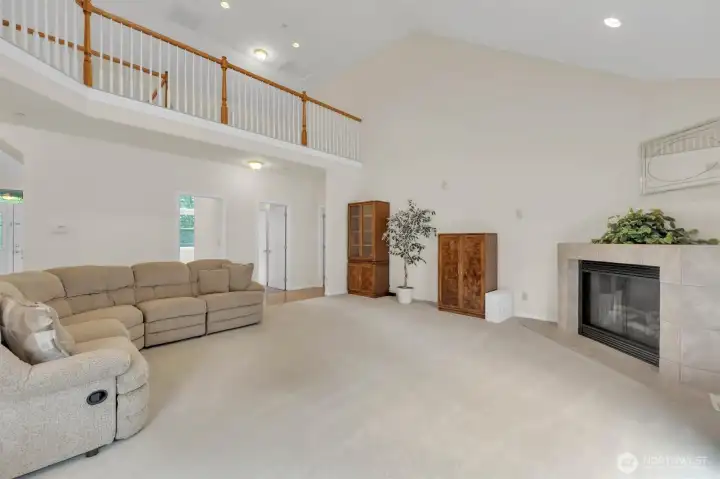 Living room with loft above