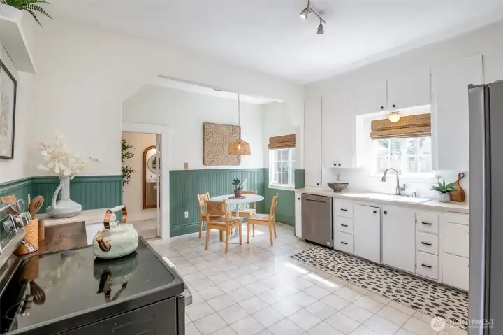The spacious kitchen has plenty of room for cooking and gathering.