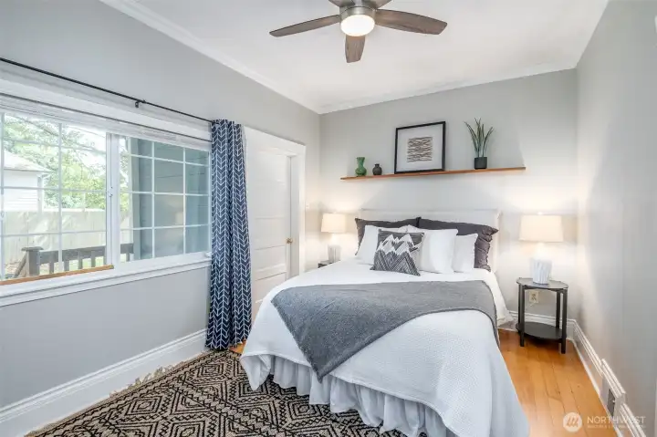 This main floor primary suite has a walk-in closet that leads to a full bath, that is also accessible from the main living area.