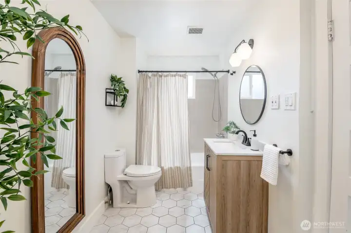 This beautiful full bath has so much character and pretty tile floors.