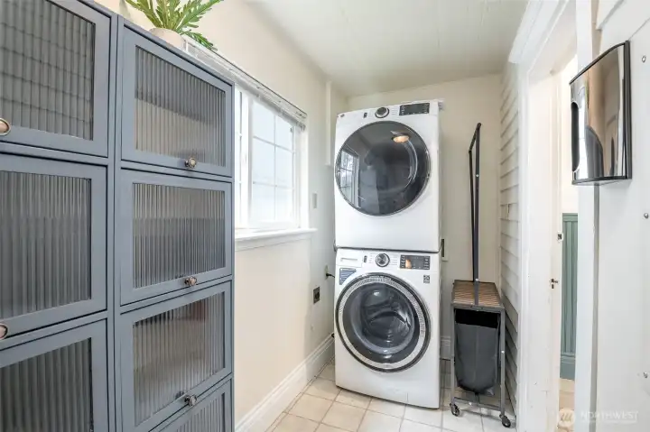 The laundry area is conveniently located just off the kitchen.