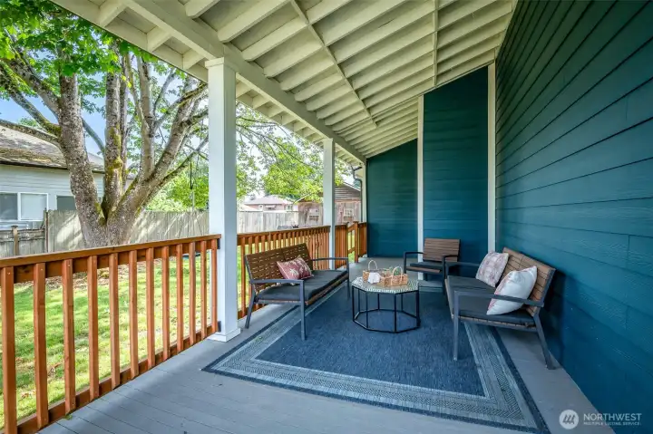 It is not hard to imagine gathering with friends on this covered porch almost all year long.