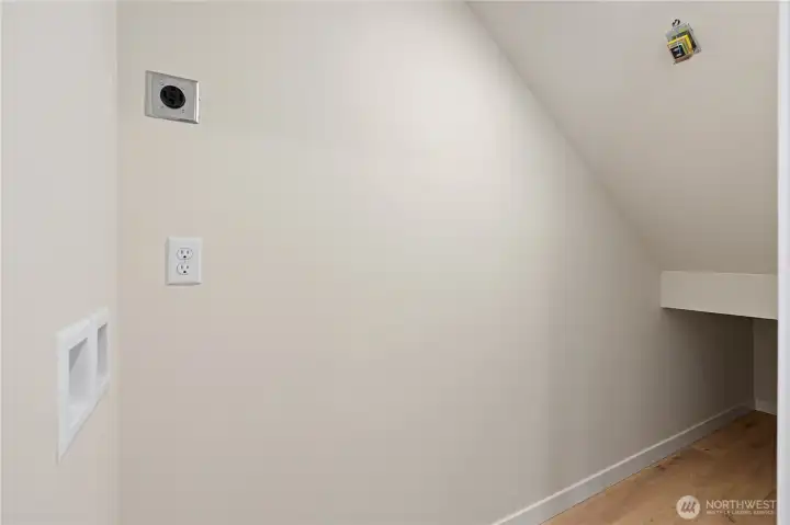 Laundry hook-ups and storage under the stairs.