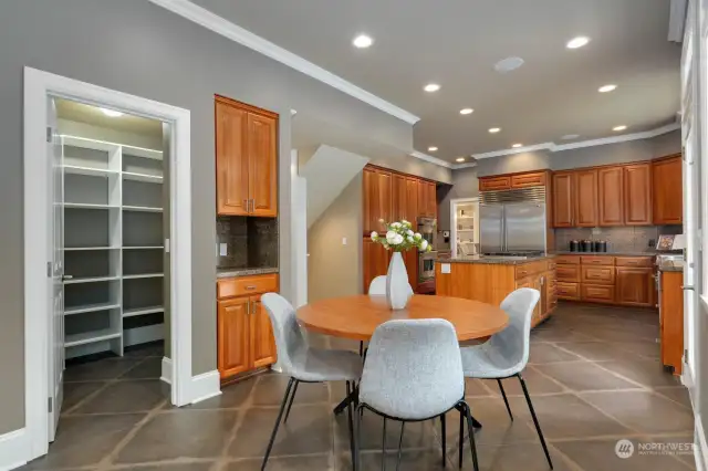 Large walk-in pantry, a nook for additional storage, and a casual dining room.